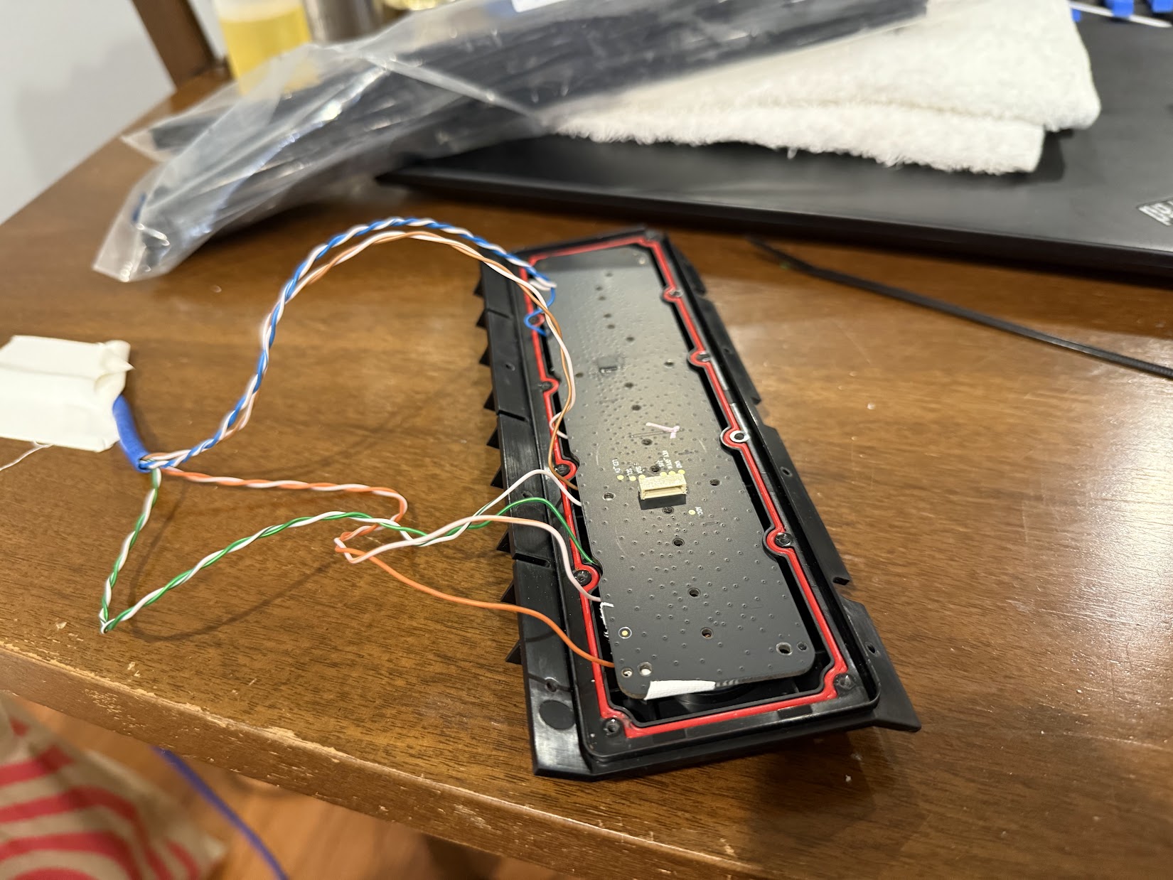 Carefully reinstalling Button Board with soldered wires